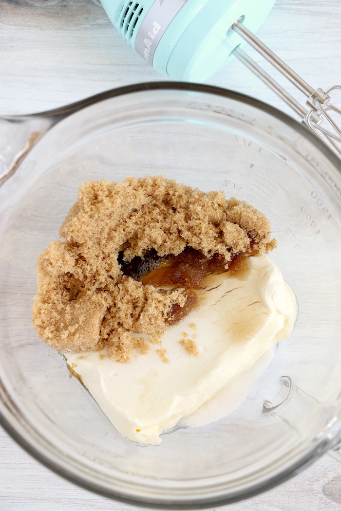 Brown sugar, vanilla and cream cheese in mixing bowl