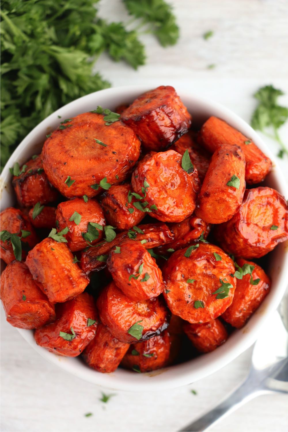 bowl of chopped balsamic carrots with parsley