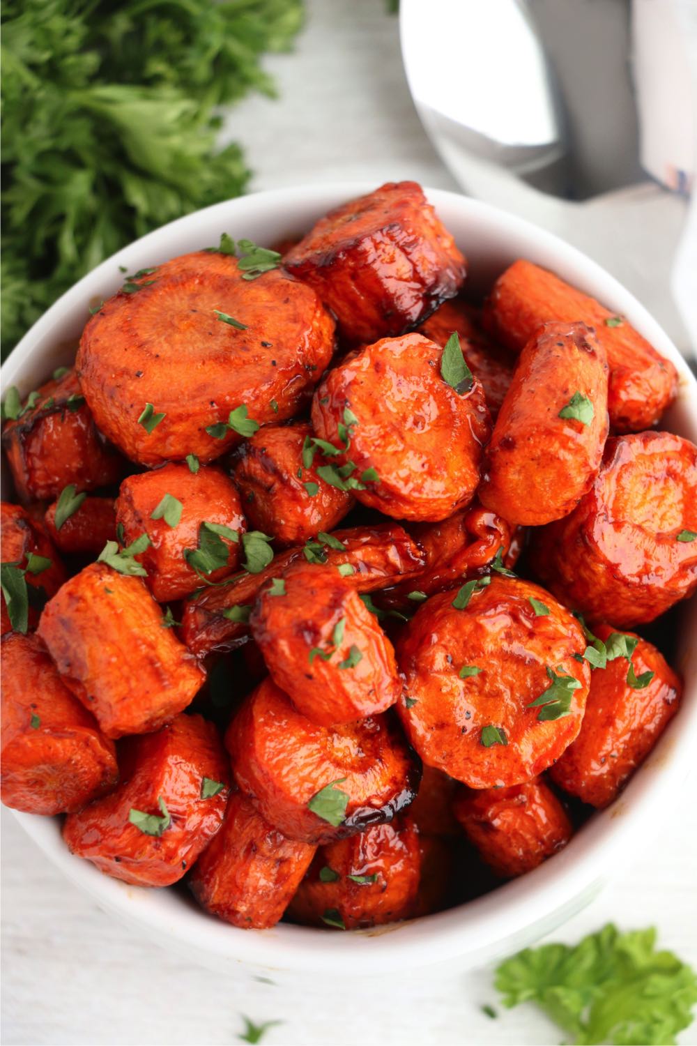 up close shot of balsamic carrots in white bowl