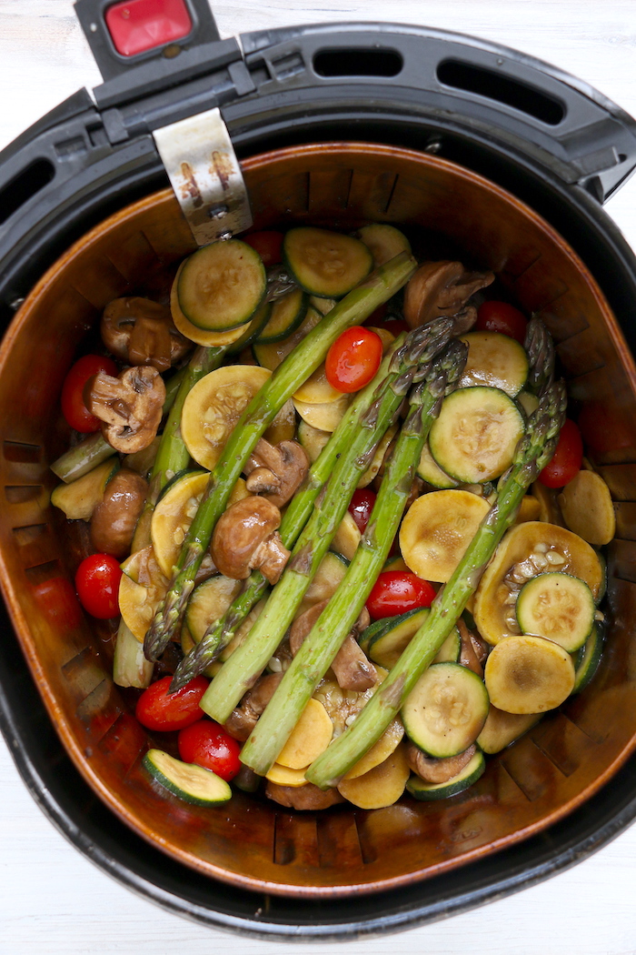 air fryer basket filled with vegetables