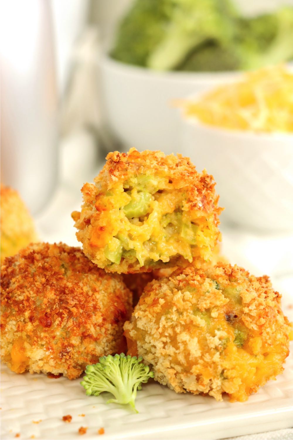 Stack of cheese balls with a bite out of one of them