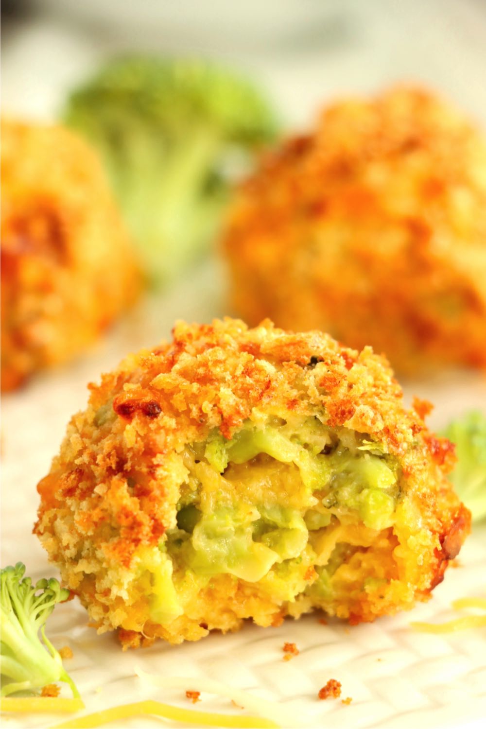 close up shot of a cheese ball with a bite taken out