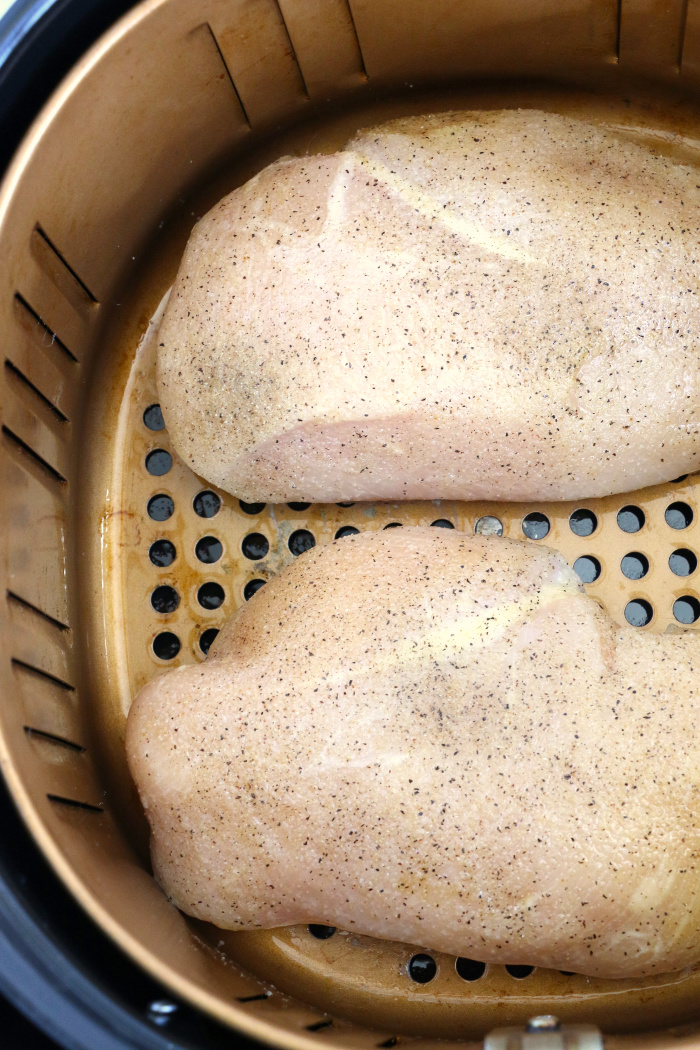 Air Fryer Chicken Breasts - Juicy and flavorful chicken breasts made right in the air fryer! Eat them on their own or add to salads, casseroles or other dishes!