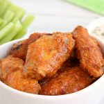 Air Fryer Chicken Wings - Delicious hot wings made in the air fryer in under 20 minutes. Use the sauce recipe provided or choose your favorite sauce!