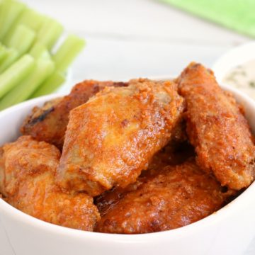 Air Fryer Chicken Wings - Delicious hot wings made in the air fryer in under 20 minutes. Use the sauce recipe provided or choose your favorite sauce!