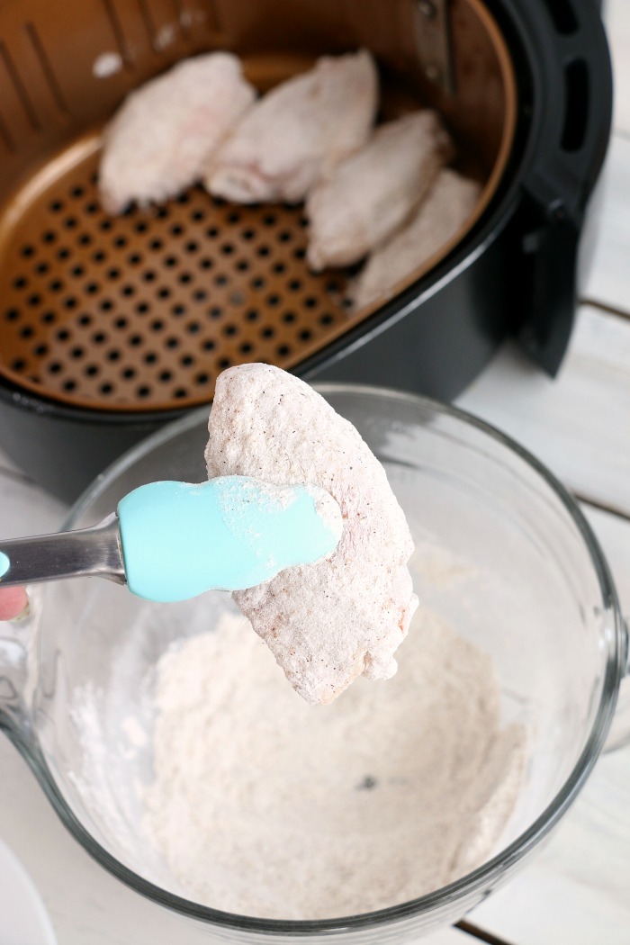 Air Fryer Chicken Wings - Delicious hot wings made in the air fryer in under 20 minutes. Use the sauce recipe provided or choose your favorite sauce!