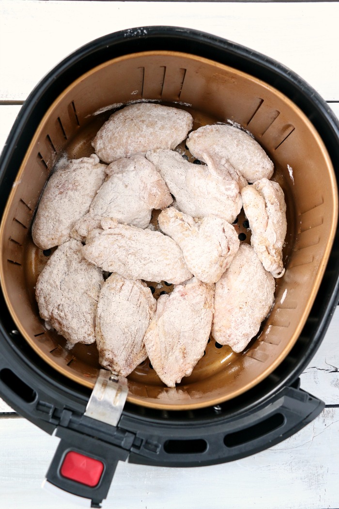 Air Fryer Chicken Wings - Delicious hot wings made in the air fryer in under 20 minutes. Use the sauce recipe provided or choose your favorite sauce!