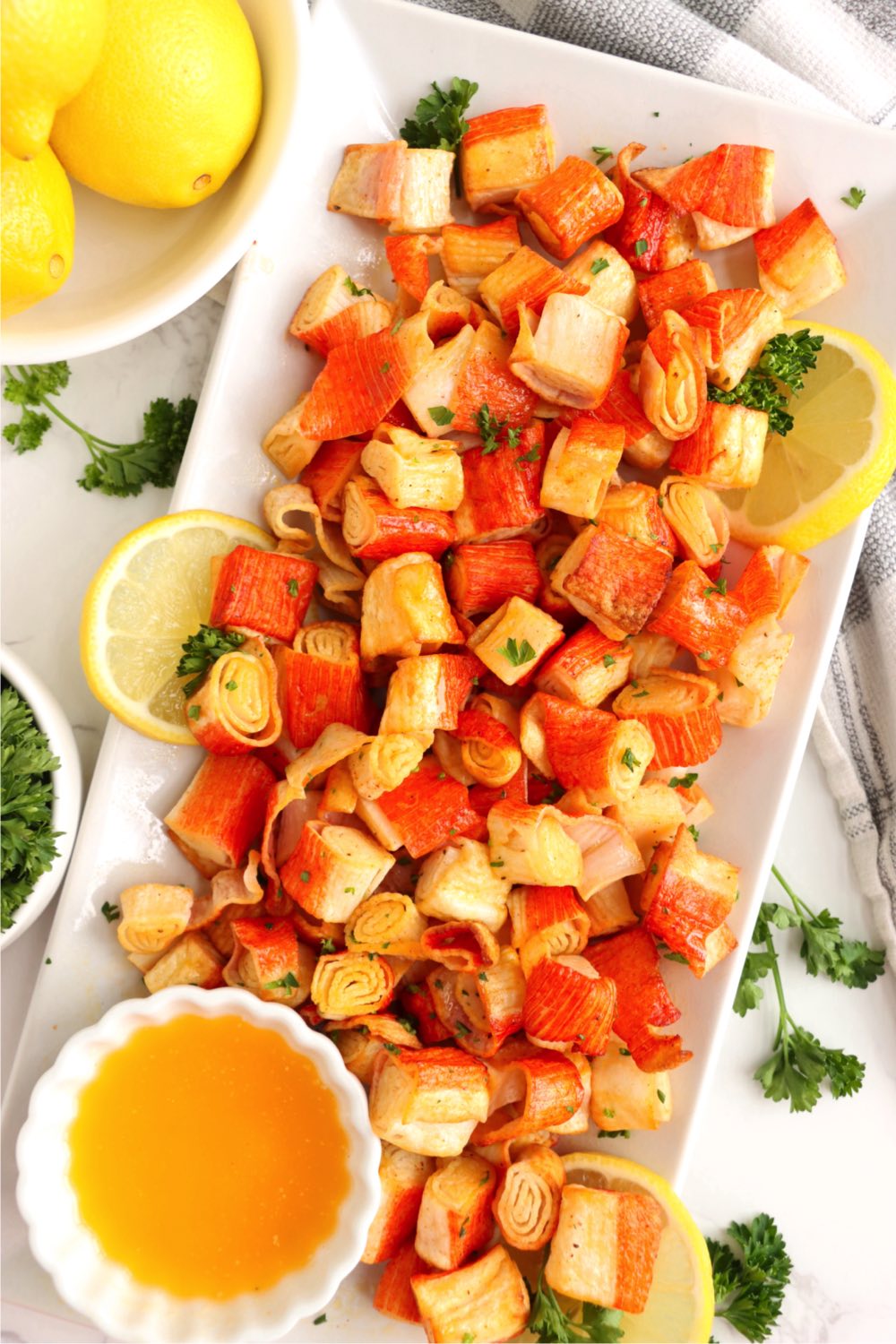 crab bites made in the air fryer on a white platter