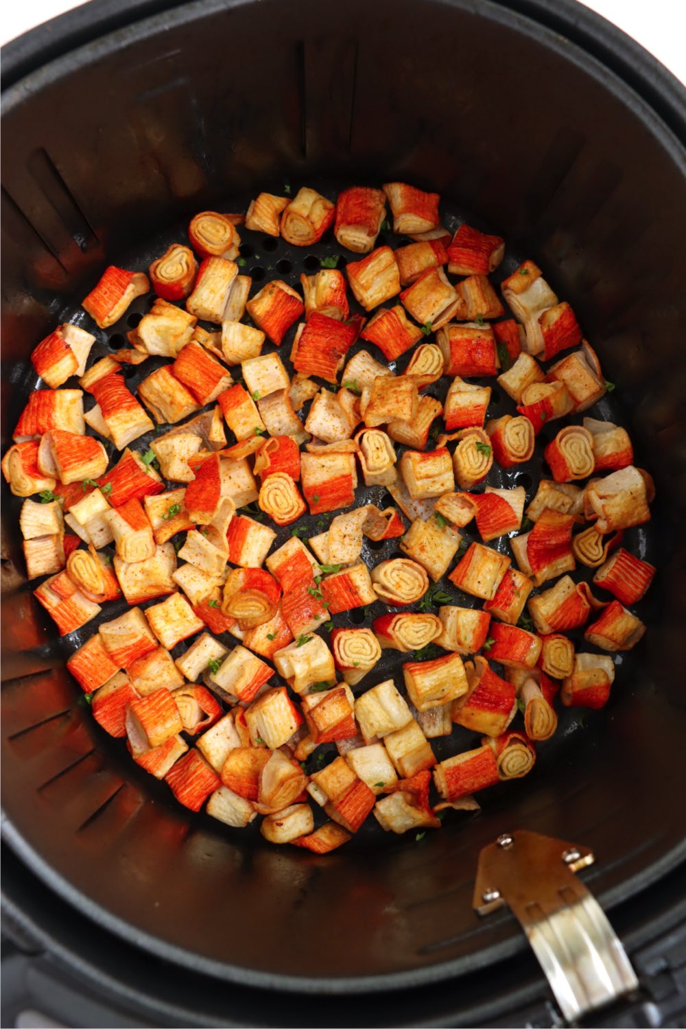 crab bites in an air fryer basket