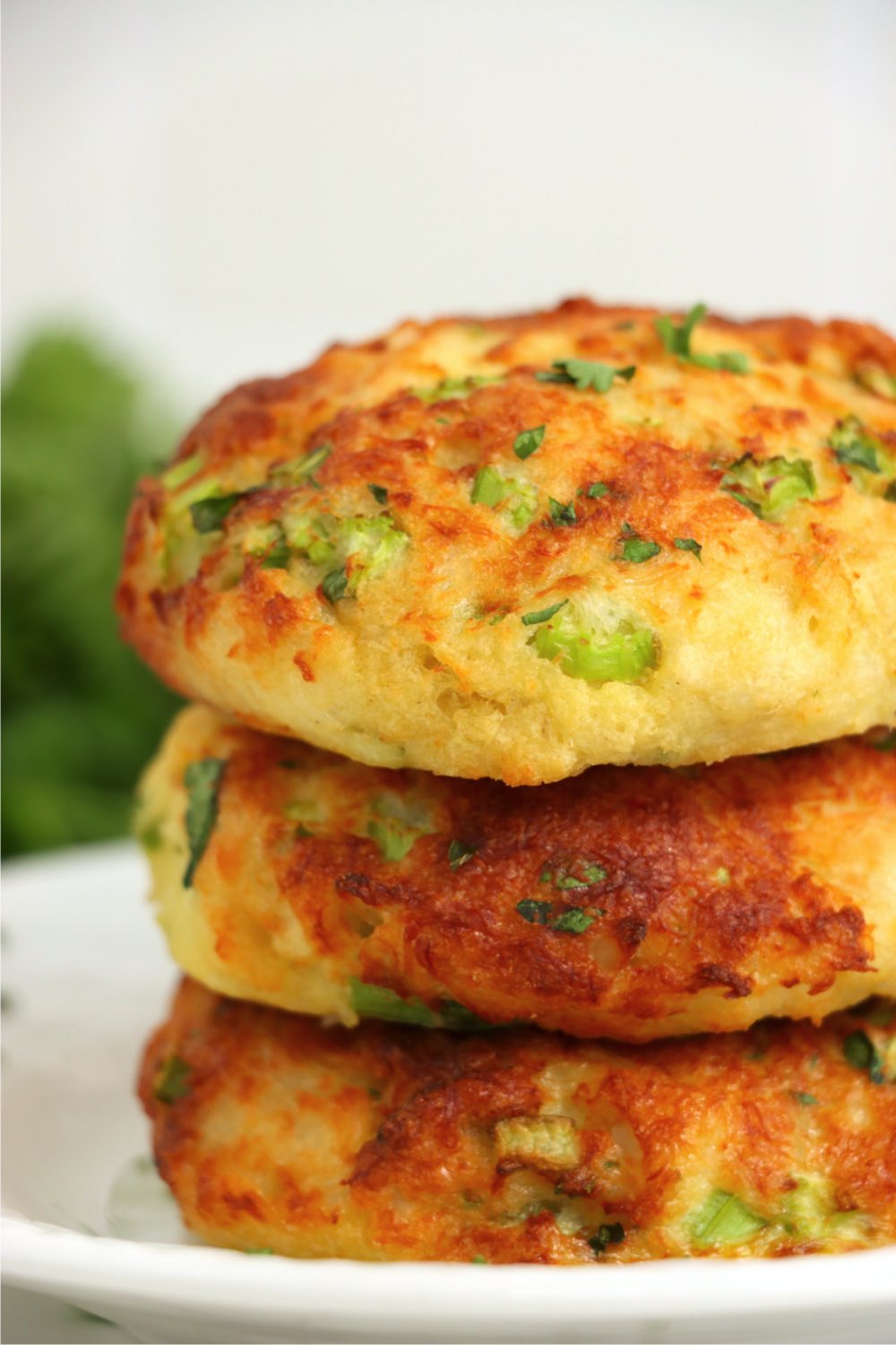 up close shot of stack of three crab cakes