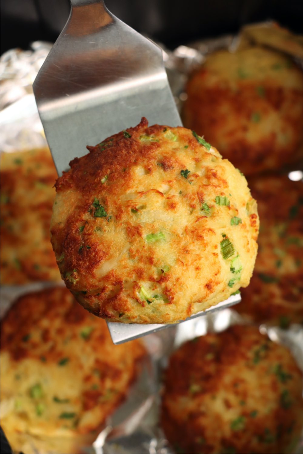 crab cake presented on a spatula
