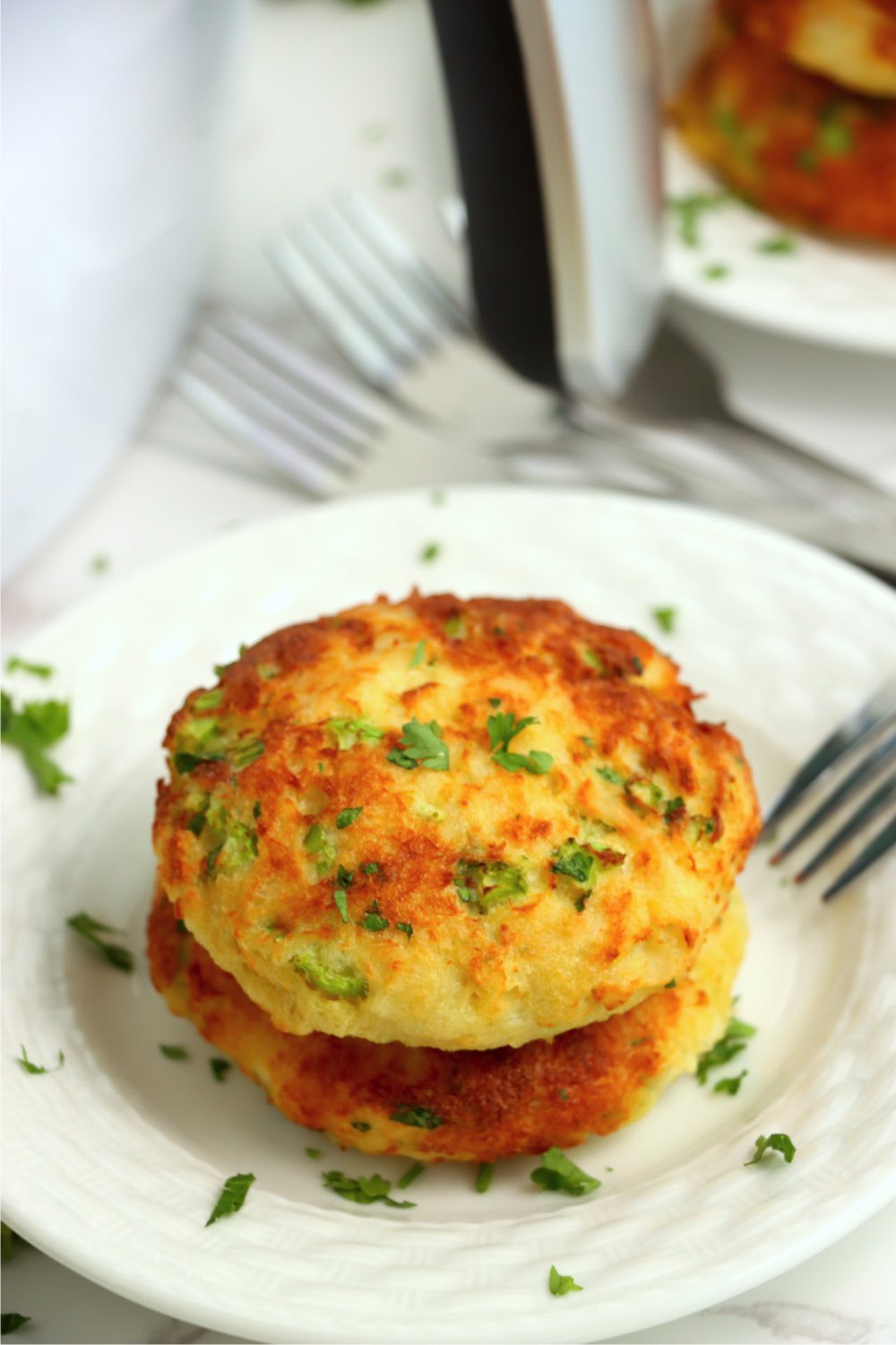 two crab cakes stacked on top of each other