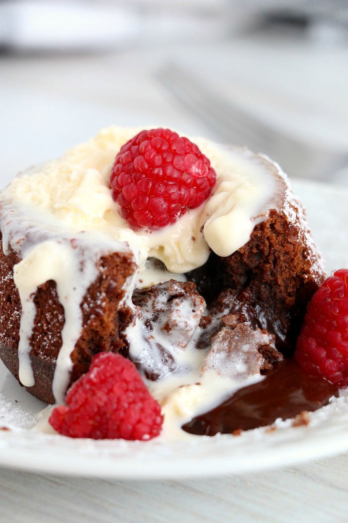 molten lava cake with raspberries and melted ice cream