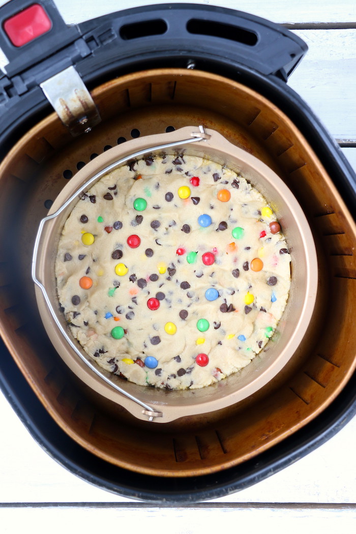 Air Fryer Pizookie - A soft and chewy cookie filled with mini chocolate chips and M&Ms made right in the air fryer in under 10 minutes! Large enough to serve a crowd!