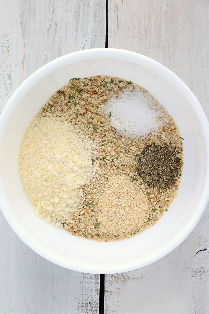 Air Fryer Pork Chops - Pork chops dredged in ranch dressing, coated in a parmesan cheese breadcrumb mixture and air fried to perfection. Tender on the inside and crispy on the outside!