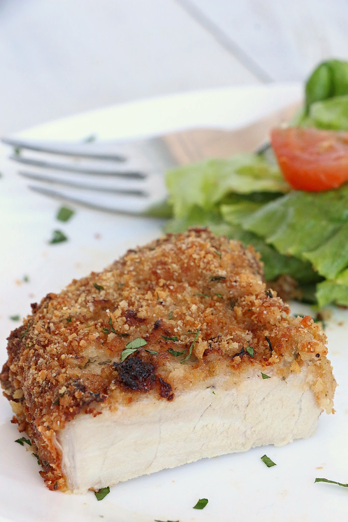 Air Fryer Pork Chops - Pork chops dredged in ranch dressing, coated in a parmesan cheese breadcrumb mixture and air fried to perfection. Tender on the inside and crispy on the outside!