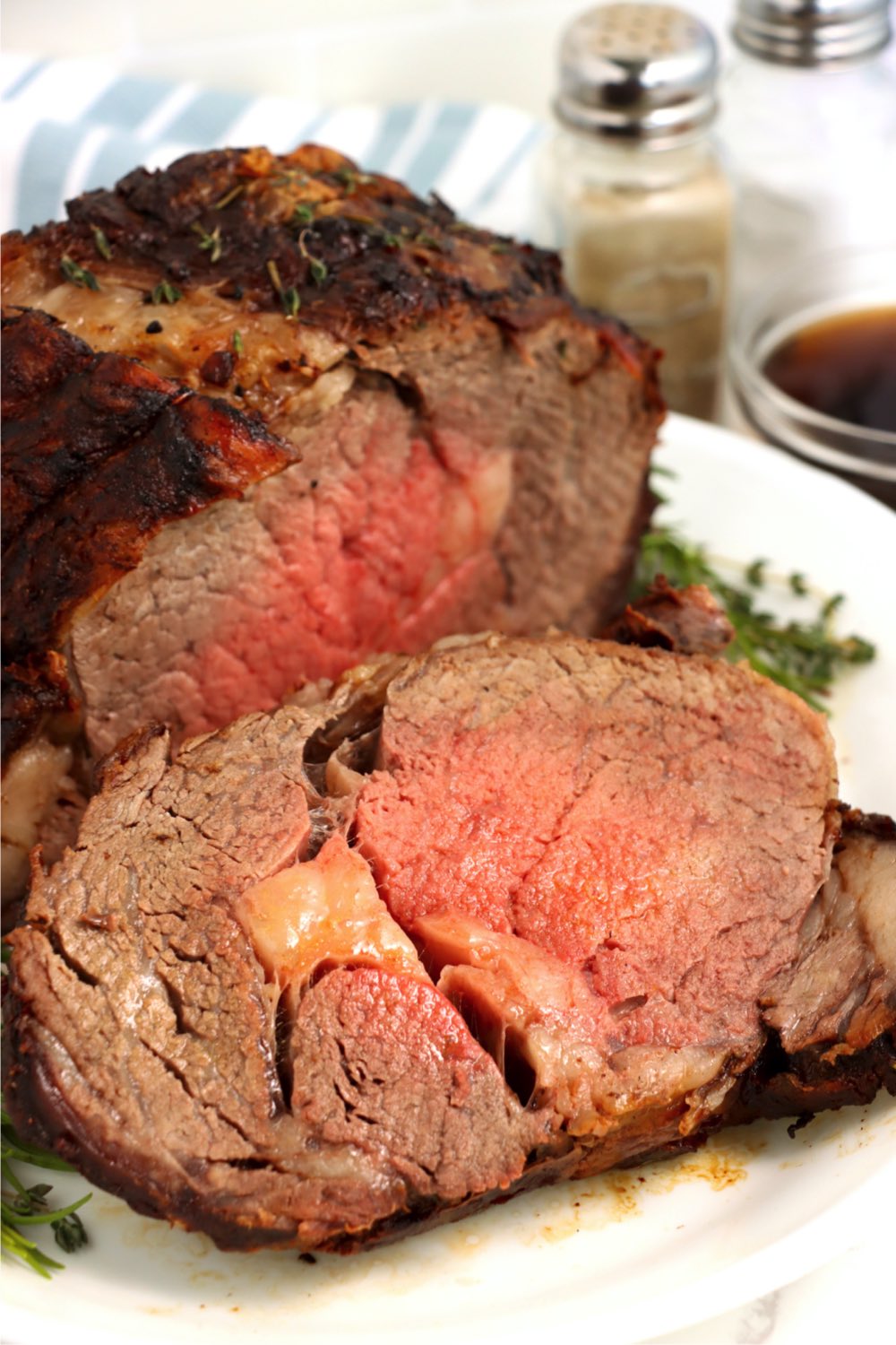 sliced prime rib on white platter
