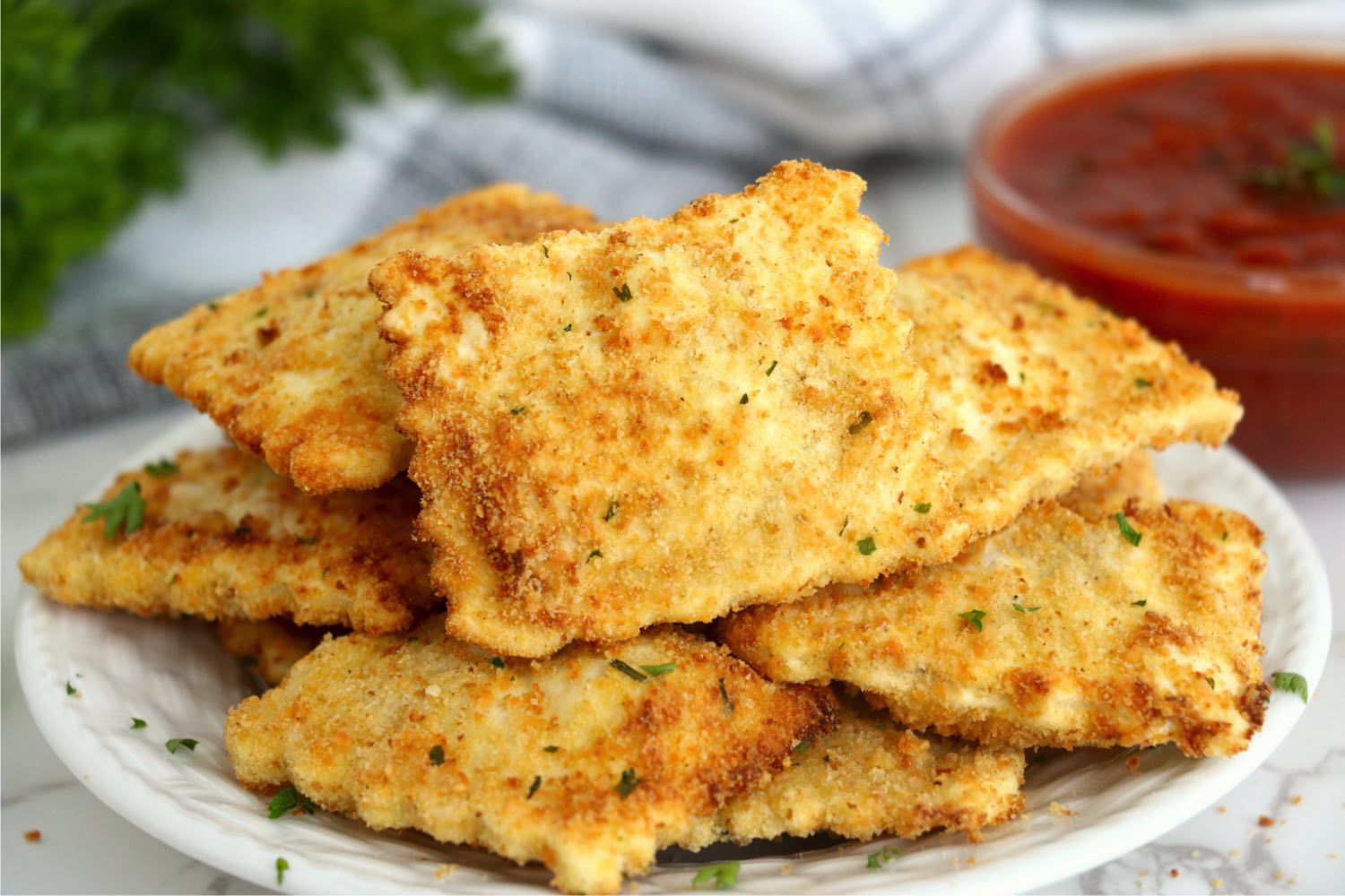 stack of toasted ravioli on a plate