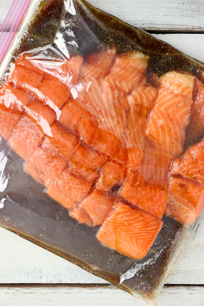 salmon and marinade in plastic storage bag