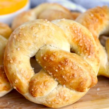 soft pretzels in front of cheese dip