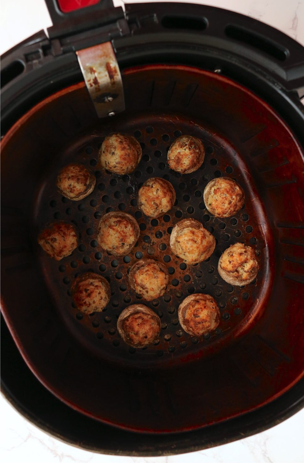 air fried stuffed mushroom caps in air fryer basket
