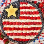 Round fruit pizza made to resemble the American flag