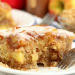 piece of apple cake with fork on plate