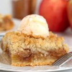 Apple Kuchen bar topped with scoop of ice cream