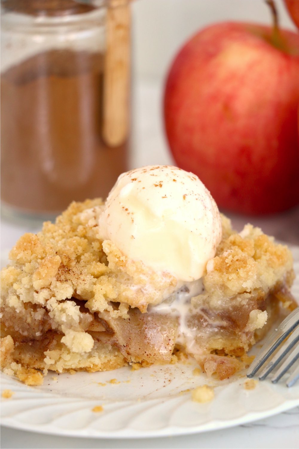 apple bar topped with ice cream with a bite out
