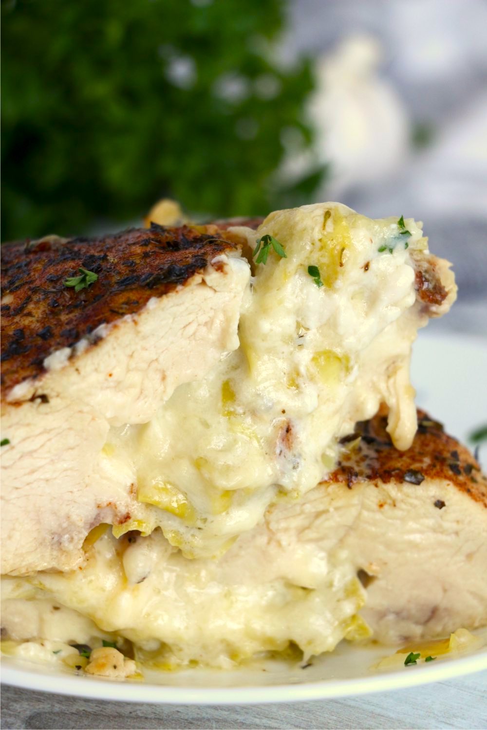 stacked chicken breast halves with artichoke filling