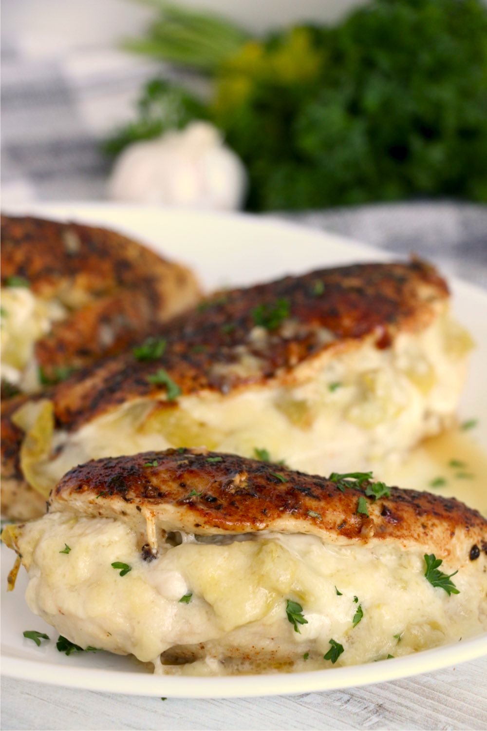 Browned chicken breasts stuffed with artichoke filling