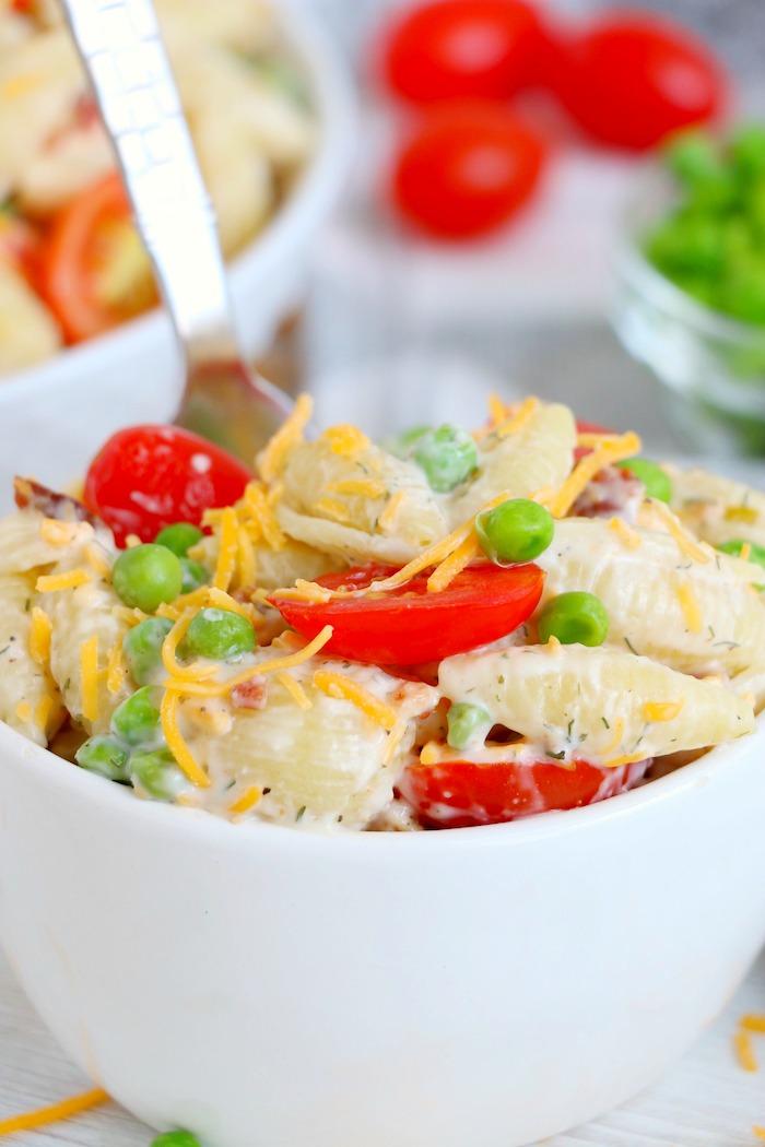Small white bowl of bacon ranch pasta salad