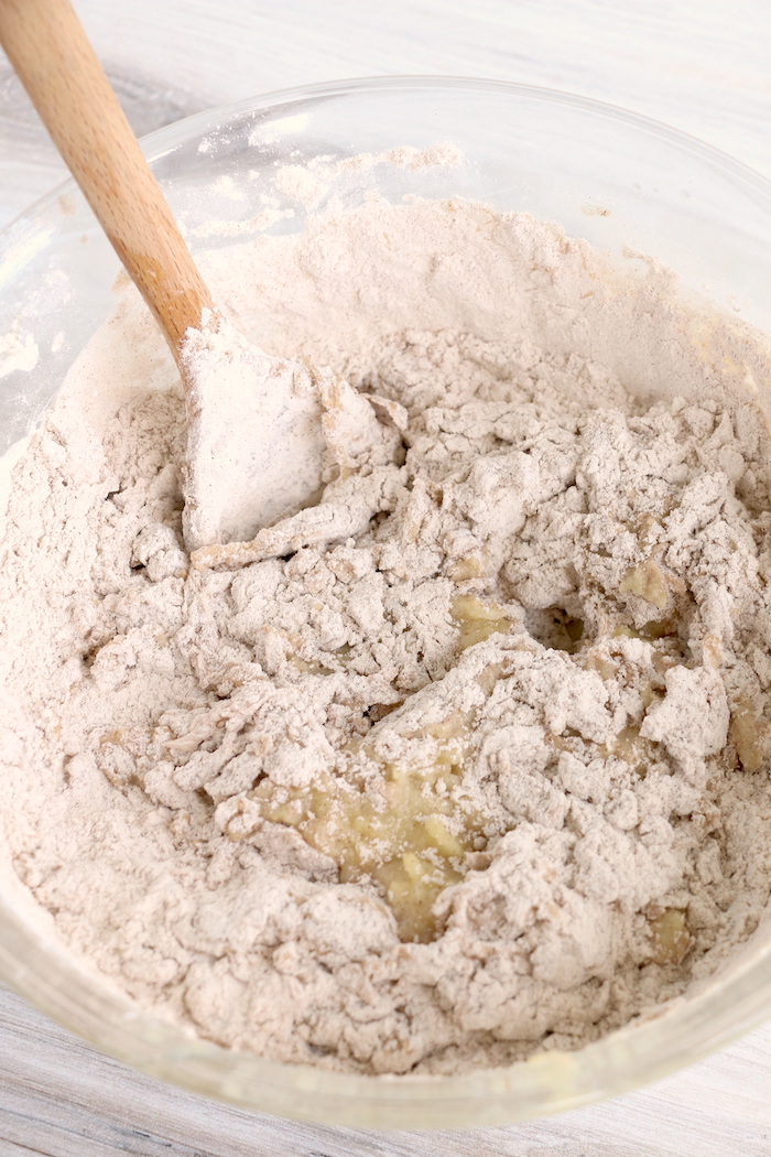 Mix shredded apples with dry ingredients for donuts