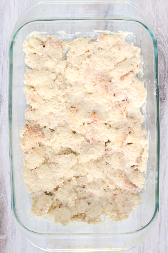 angel food cake pieces covered with cream in pan