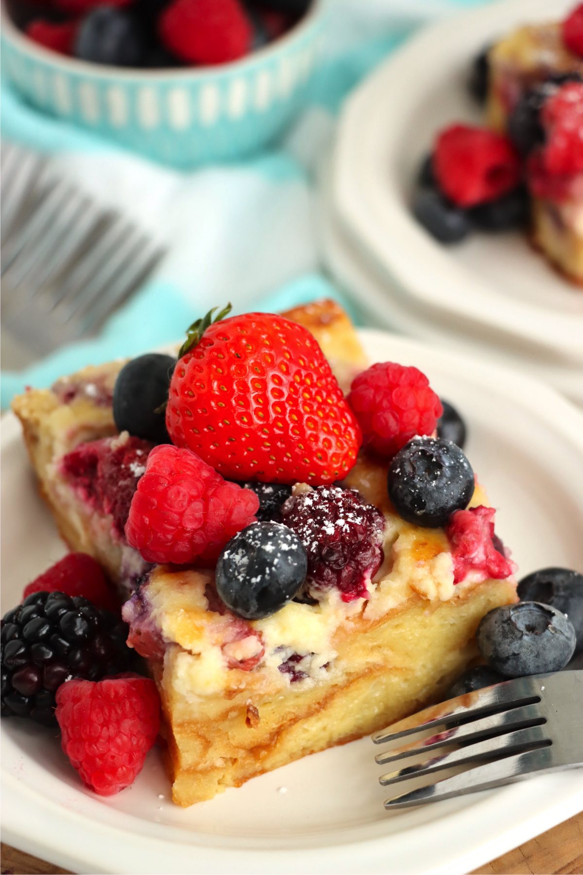 piece of croissant dessert covered in fresh berries
