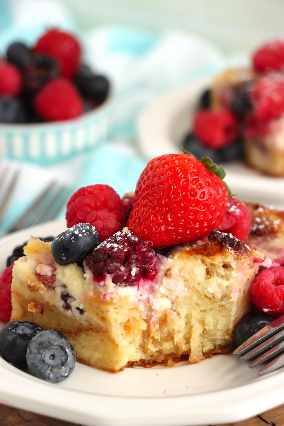 piece of croissant dessert covered in berries