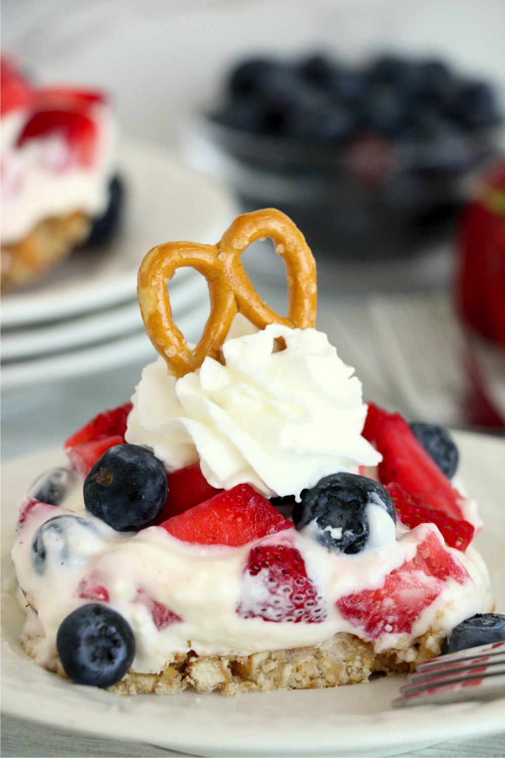 berry dessert with pretzel for garnish