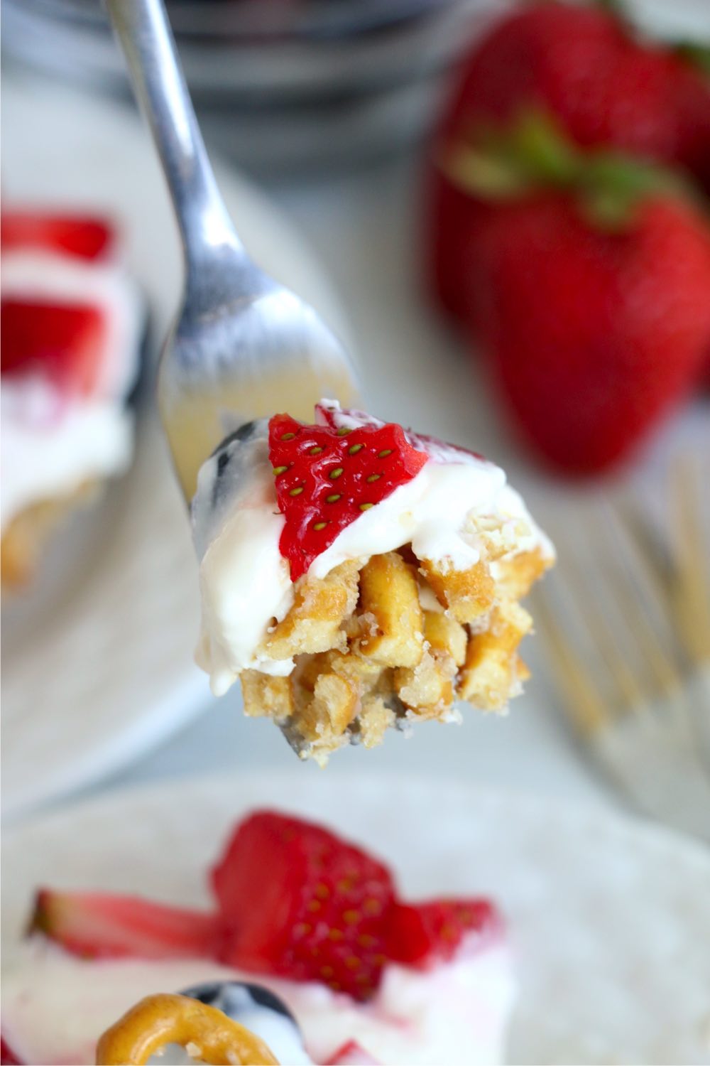 forkful of berry pretzel dessert