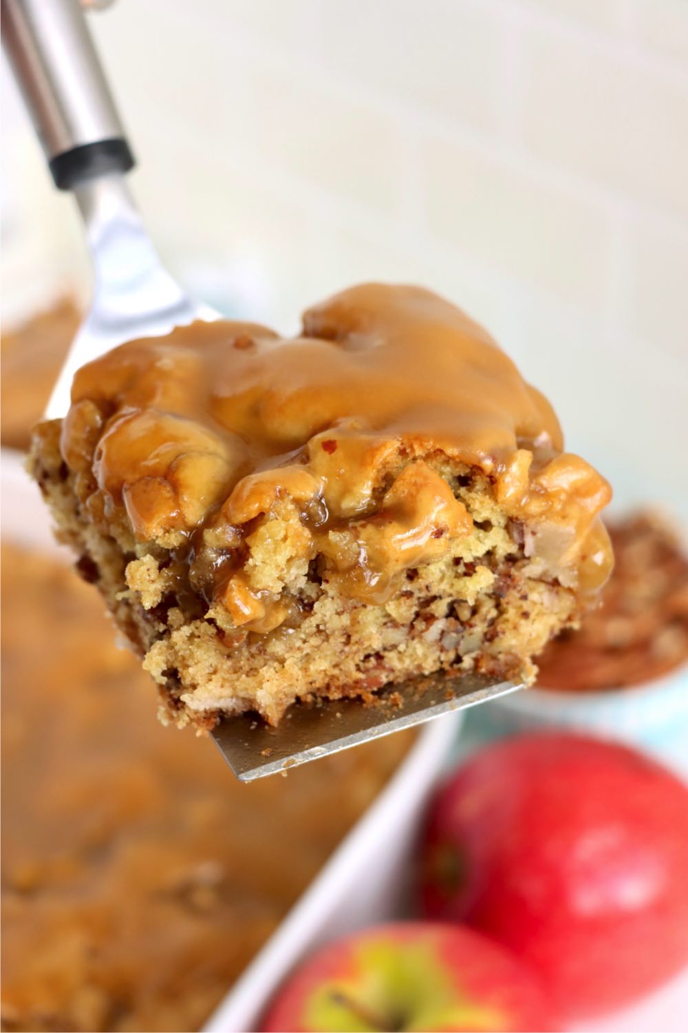 spatula holding a piece of apple cake