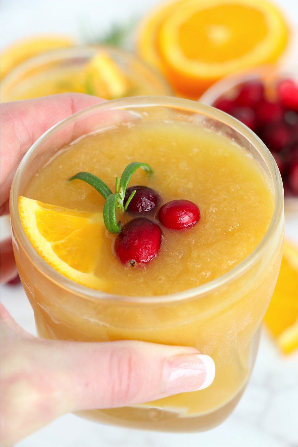 hand holding glass of brandy slush