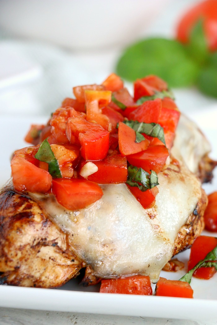 chicken breast topped with fresh bruschetta