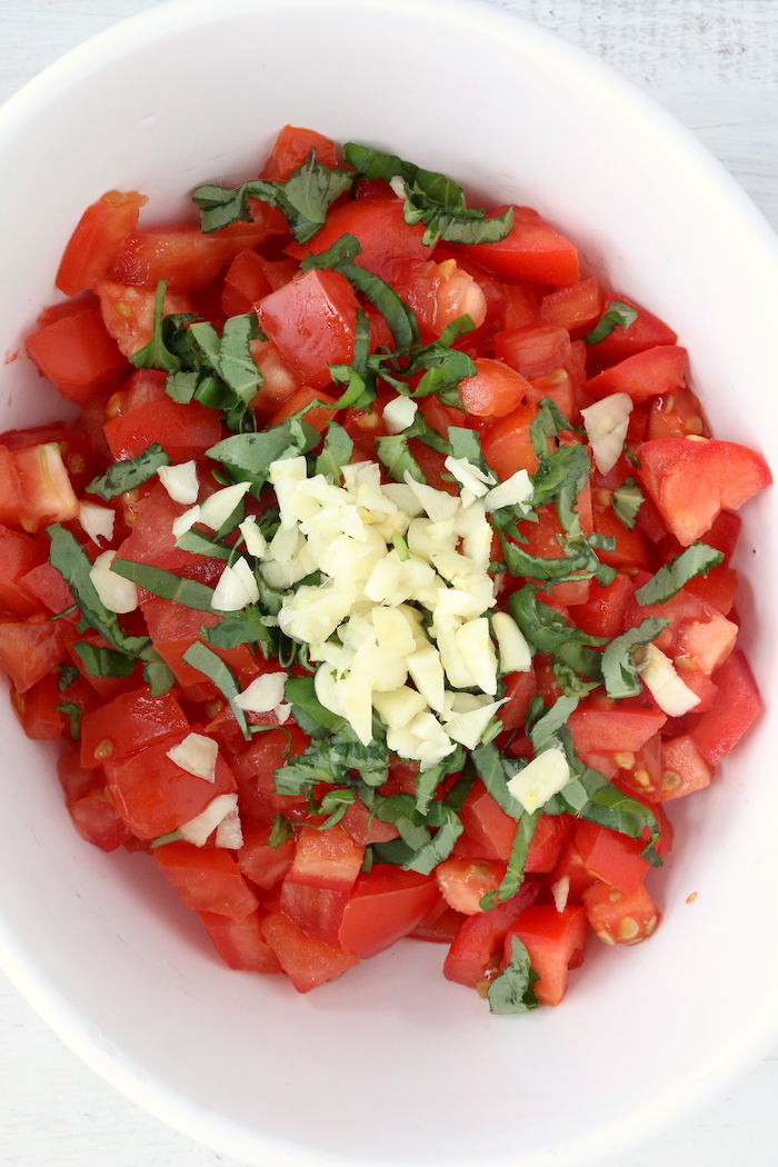 bruschetta ingredients in a white bowl