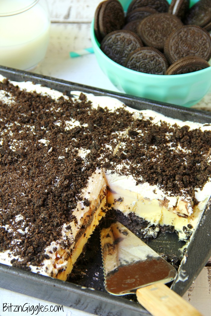 Buster Bar Lasagna - Decadent layers of Oreo cookies, ice cream, hot fudge, Snickers bars and whipped topping make up this delicious 5-layer dessert!