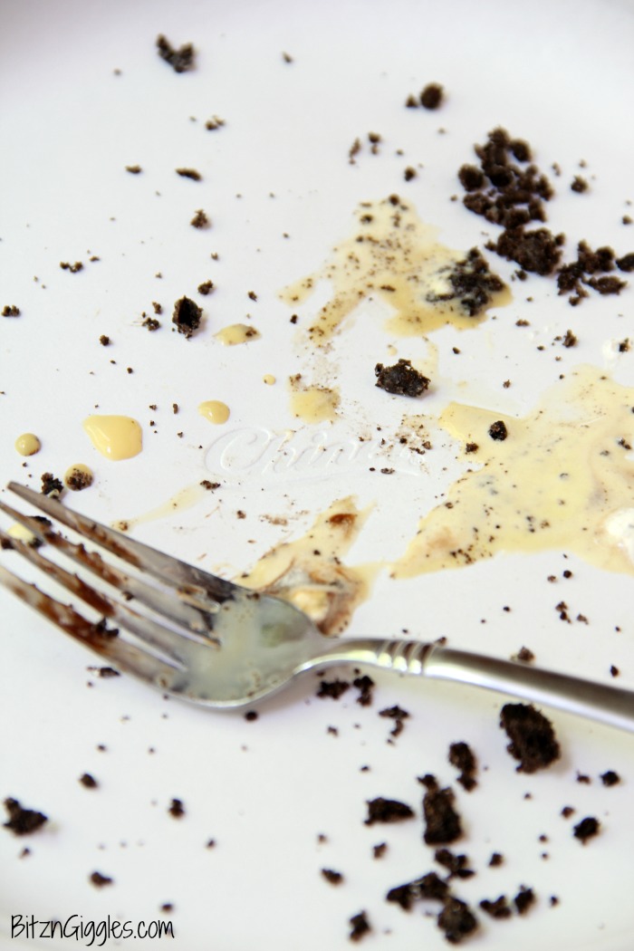 Buster Bar Lasagna - Decadent layers of Oreo cookies, ice cream, hot fudge, Snickers bars and whipped topping make up this delicious 5-layer dessert!