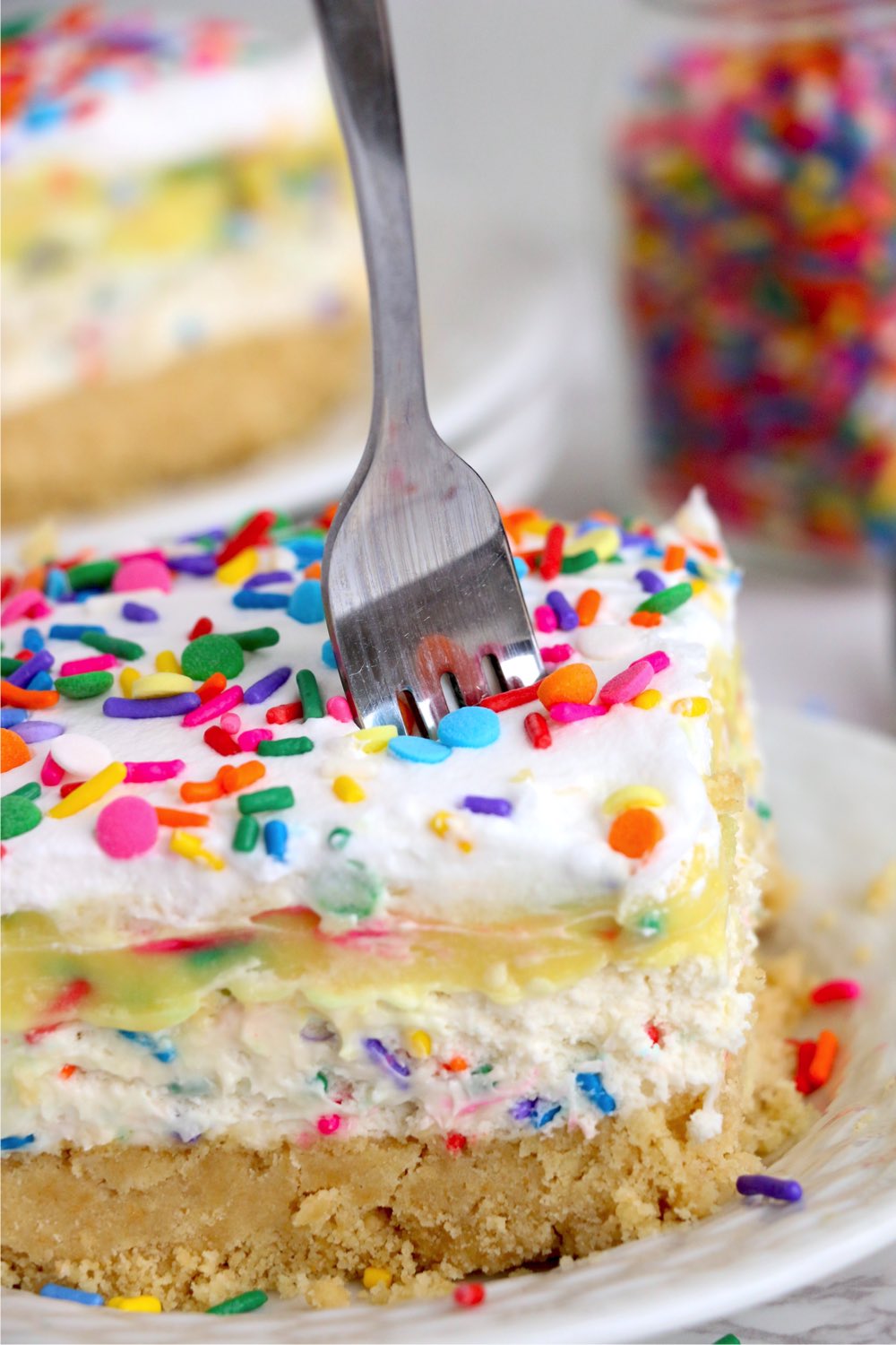 fork going into a pudding layer dessert