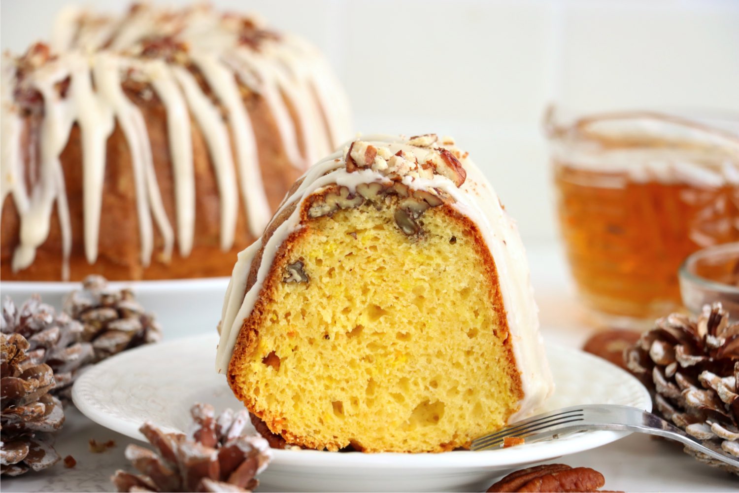 piece of rum cake with icing on a plate
