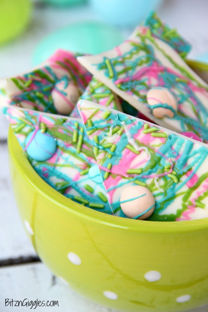 Drizzled Candy Bark - A fun twist on traditional candy bark with M&Ms, sprinkles and colored candy coating drizzle! Perfect for spring and Easter!