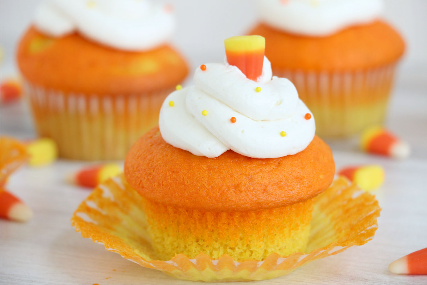horizontal photo of unwrapped candy corn cupcake