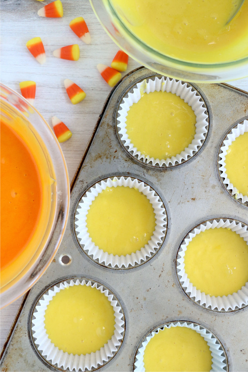 yellow batter in cupcake tin