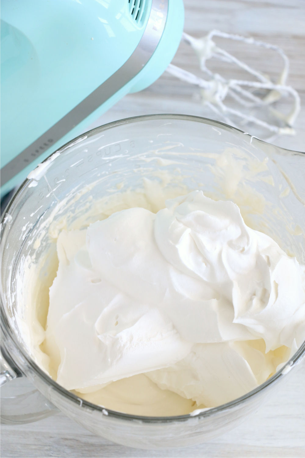 Adding marshmallow creme and whipped topping to frosting